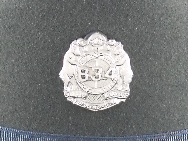 Missouri Highway Patrol silver numbered hat badge
